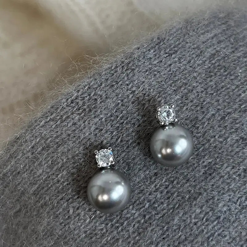 Elegantit korvakorut mustalla helmellä ja zirkoneilla